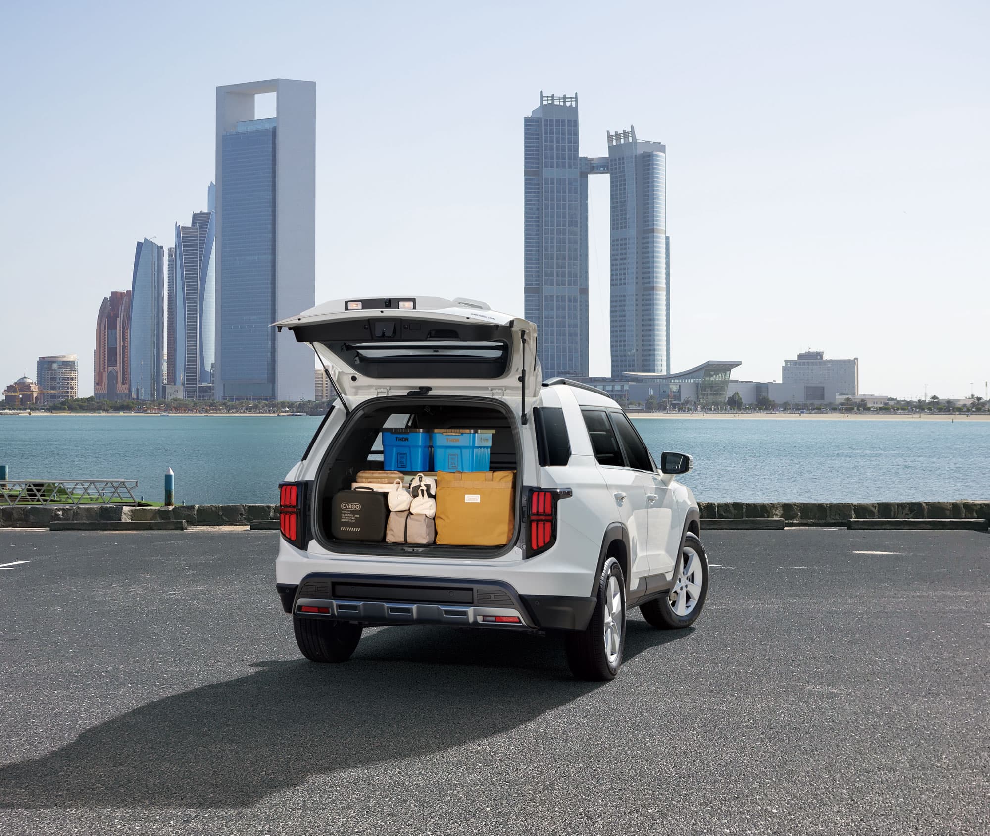 KGM Torres EVX VAN parked with open trunk